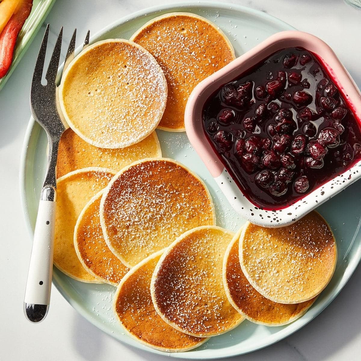 Lemon Ricotta Pancakes with Warm Blueberry Sauce - Image