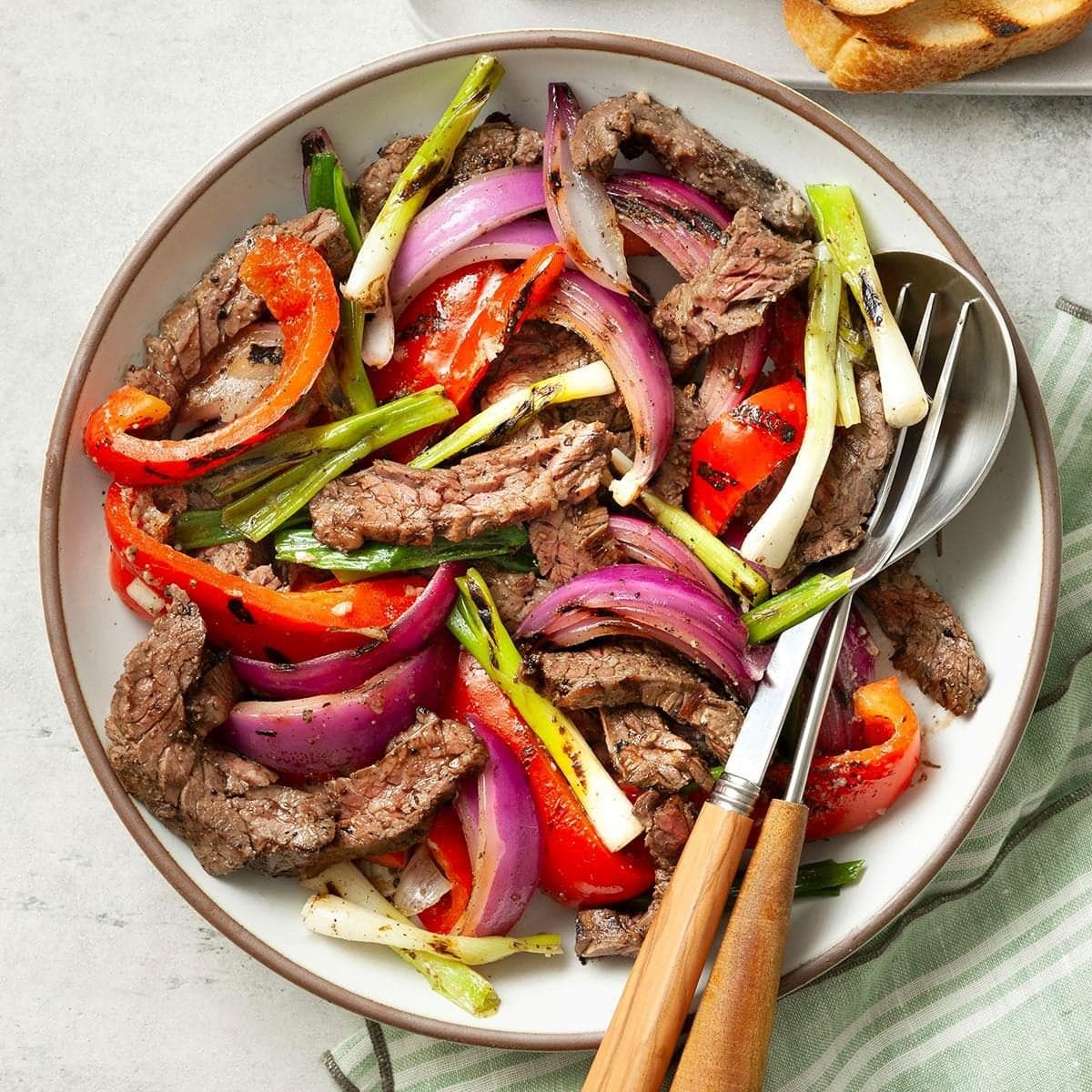Grilled Skirt Steak with Peppers and Onions - Image